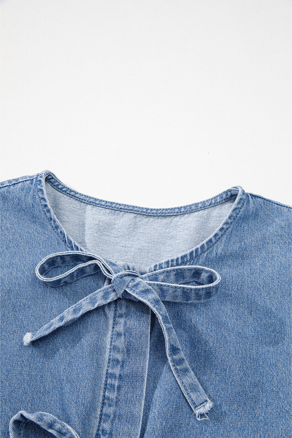The Piper Skye Bow Peplum Denim Shirt
