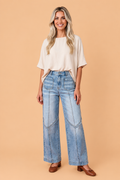 The Delilah Studded Denim Wide Leg Jeans
