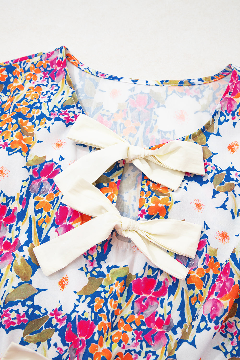 The Amelia June Floral Bow Peplum Blouse