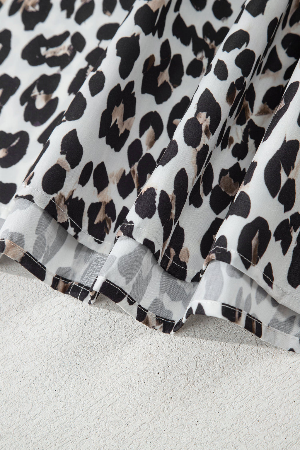 The Ava Leopard Contrast Trim Half Button Top
