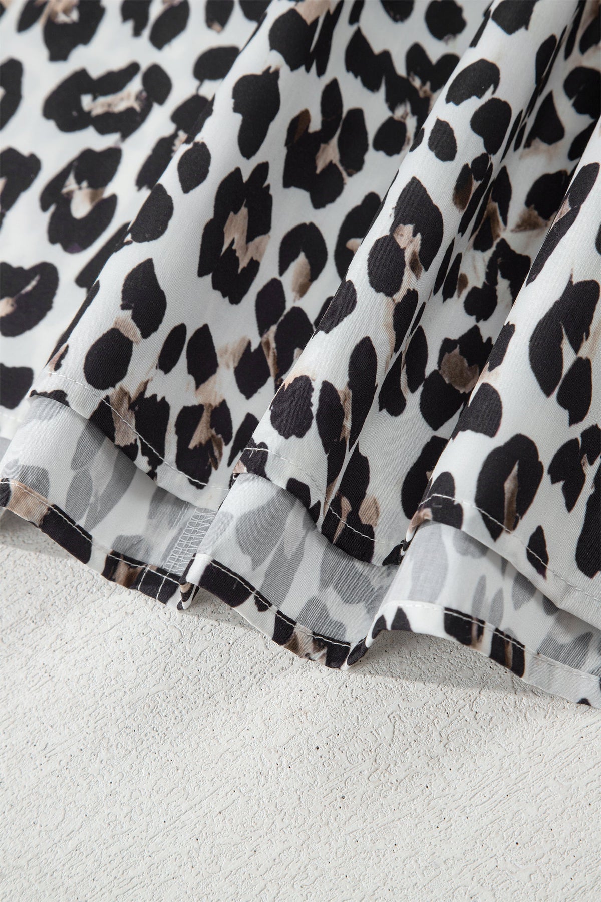 The Ava Leopard Contrast Trim Half Button Top
